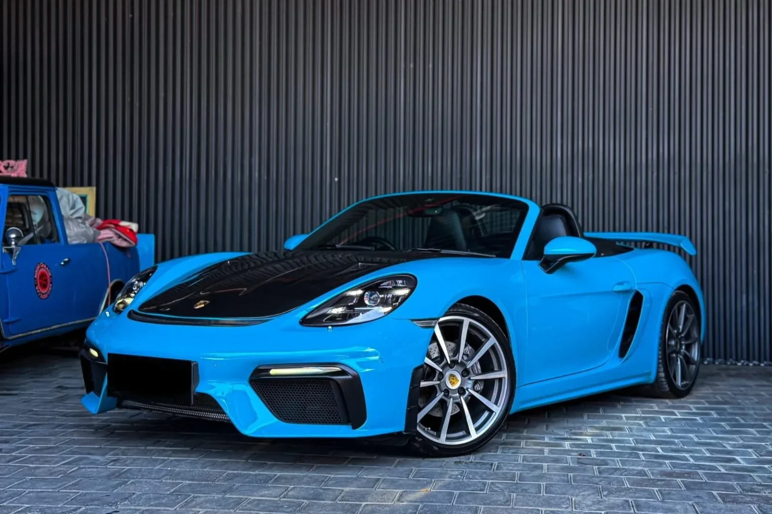 Porsche 718 GT4 Blue model reference; current rental-unit photographs available on request